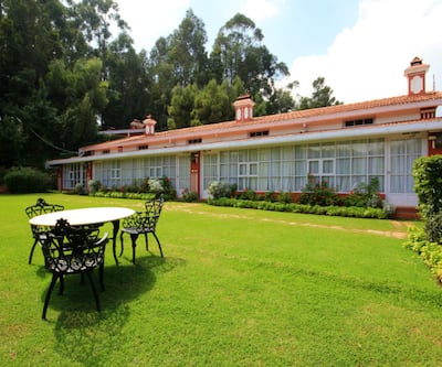 https://imgcld.yatra.com/ytimages/image/upload/t_hotel_yatra_city_desktop/v1432090995/Domestic Hotels/Hotels_Ooty/Hotel Kluneys Mystique Ville/Classic_Cottage_1.jpg